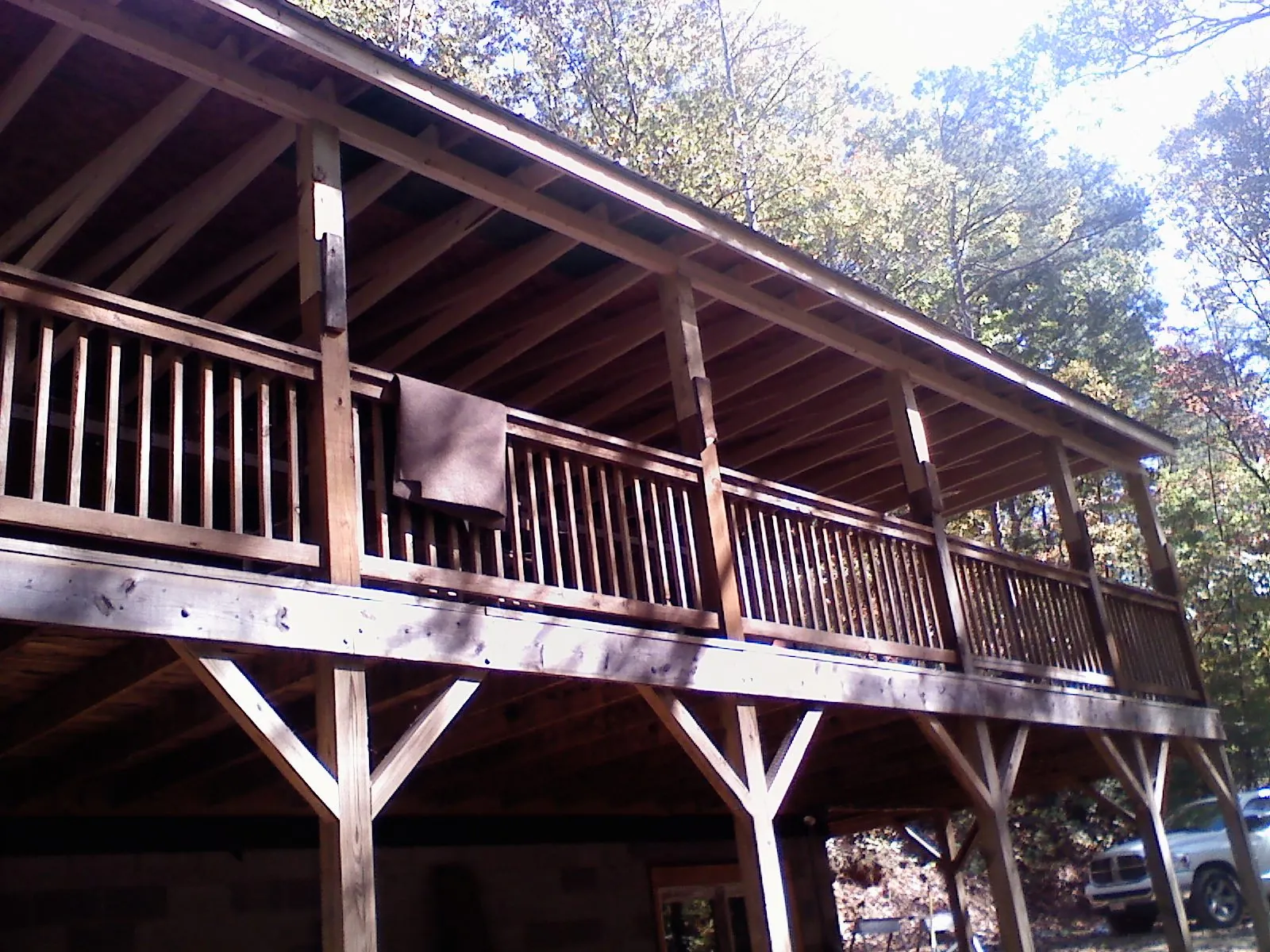 Timber framing under a new elevated porch and deck — Roof Leak Repair in What Cheer by Roofing Brothers